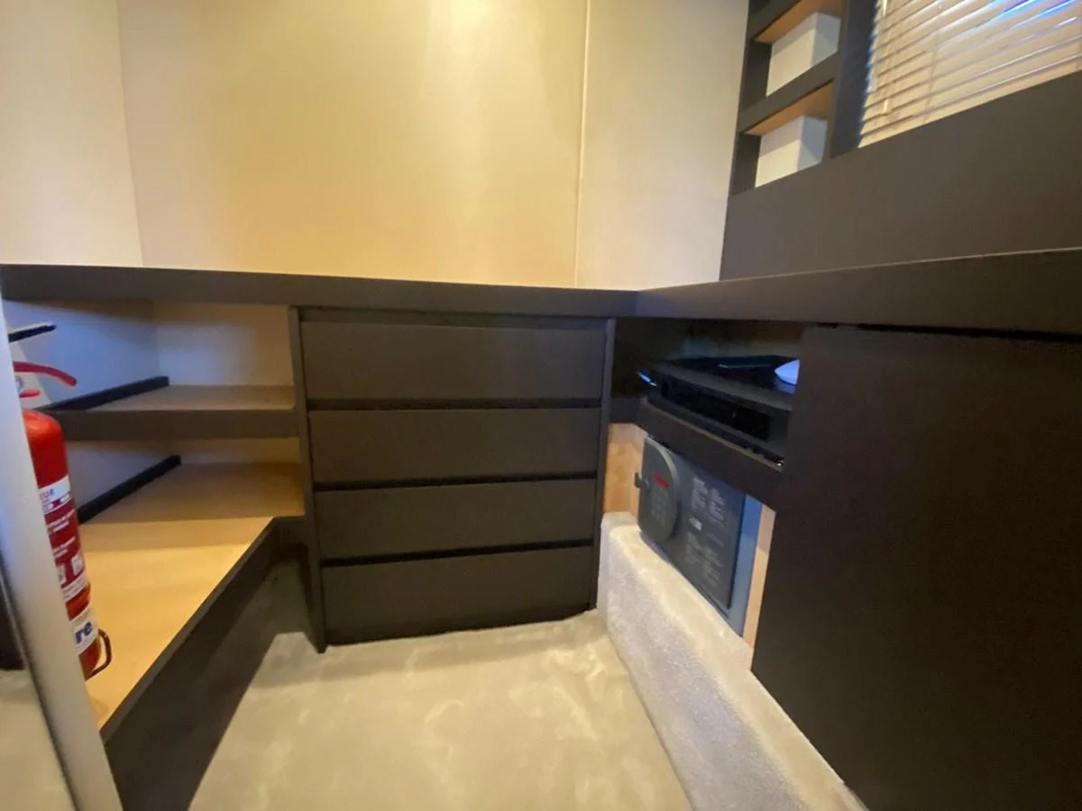 a room with a shelf and a computer aboard 10009846 Yacht for Sale