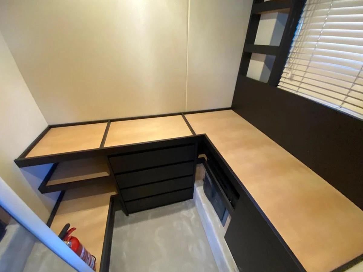 a room with a table and a window aboard 10009846 Yacht for Sale