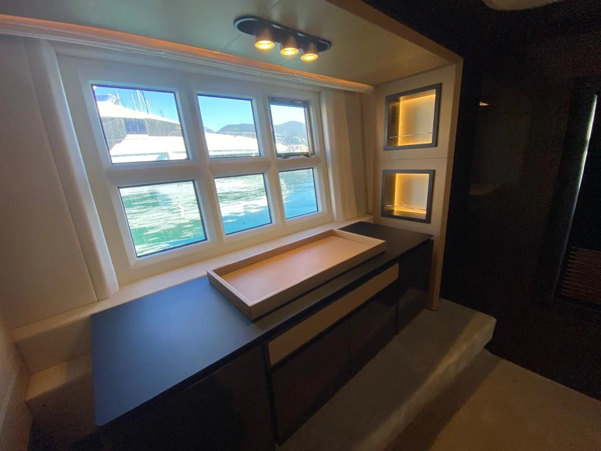 a room with a window and a table aboard 10009846 Yacht for Sale