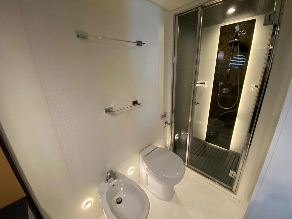 a bathroom with a glass shower aboard 10009846 Yacht for Sale