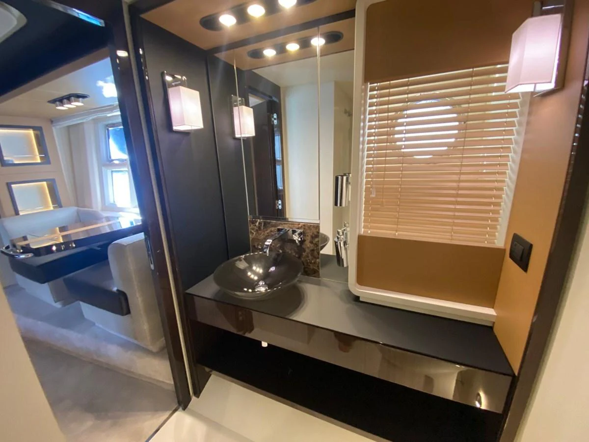a bathroom with a large mirror aboard 10009846 Yacht for Sale