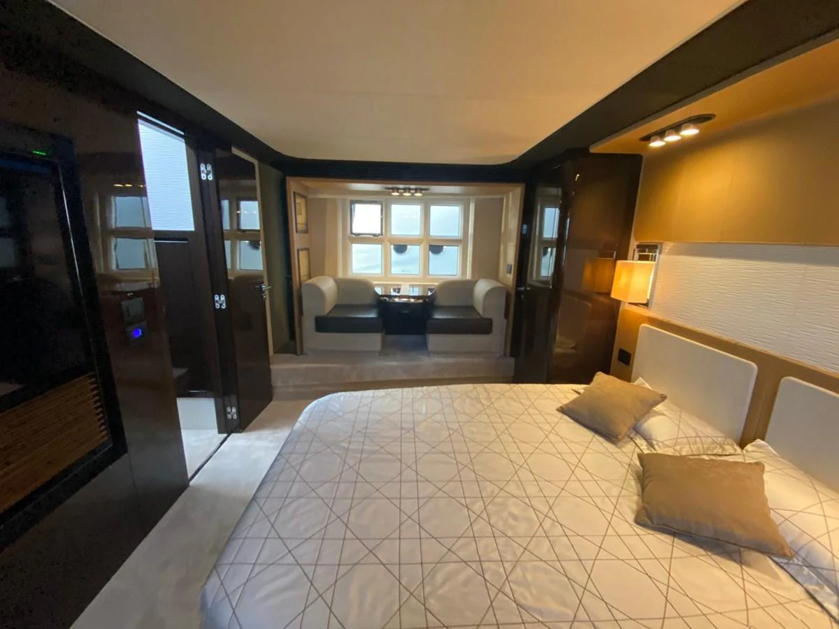 a hotel room with a bed and a couch aboard 10009846 Yacht for Sale