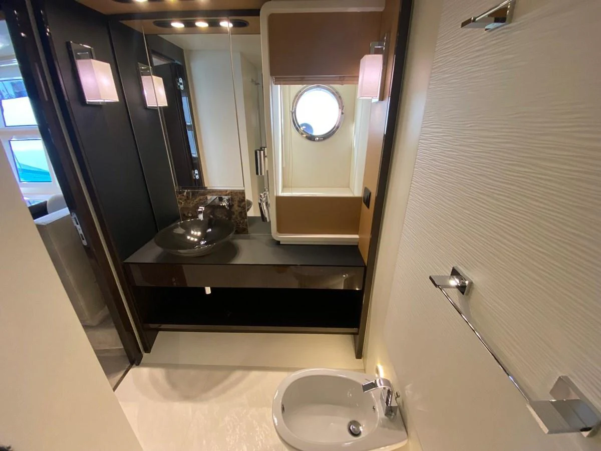 a bathroom with a sink and a mirror aboard 10009846 Yacht for Sale