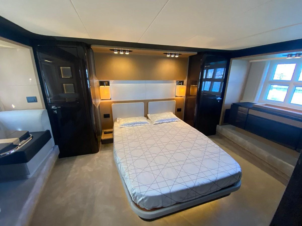 a room with a bed and desk aboard 10009846 Yacht for Sale