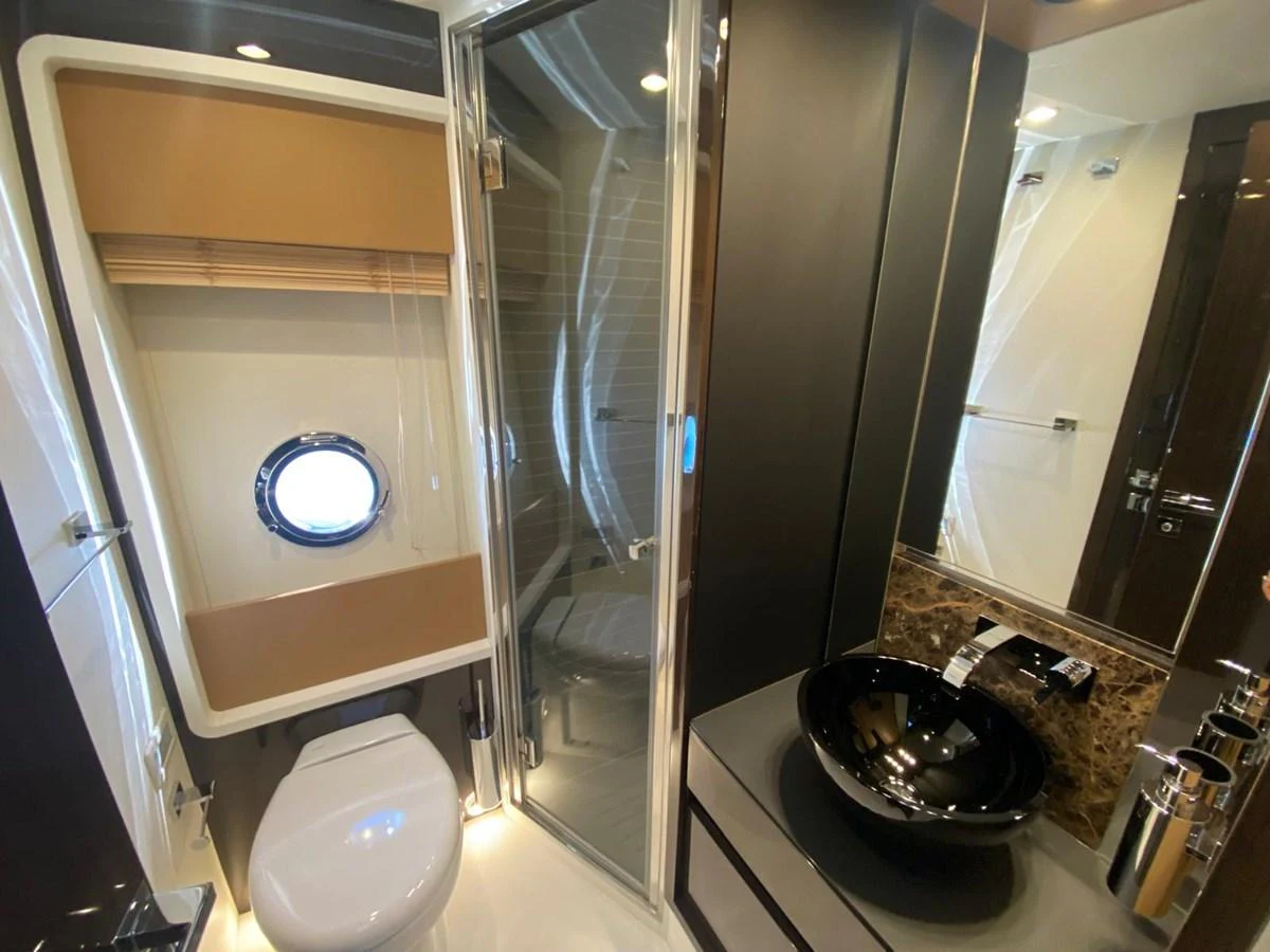 a bathroom with a large mirror aboard 10009846 Yacht for Sale