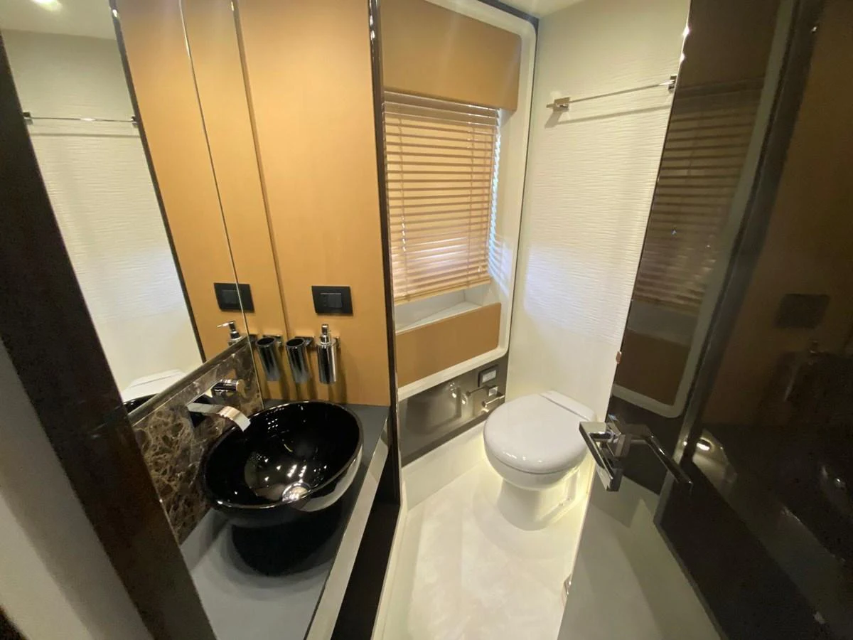 a bathroom with a toilet and a sink aboard 10009846 Yacht for Sale