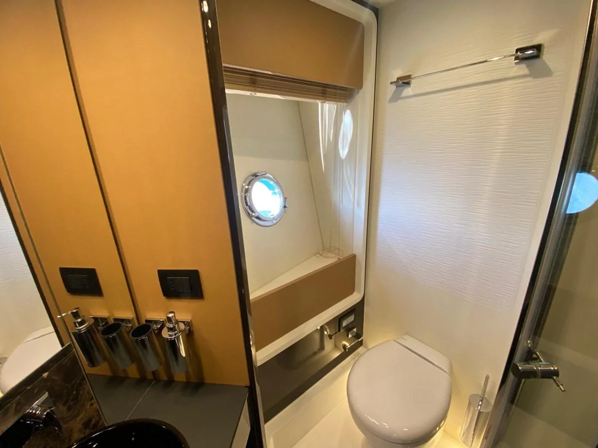 a bathroom with a toilet and a sink aboard 10009846 Yacht for Sale