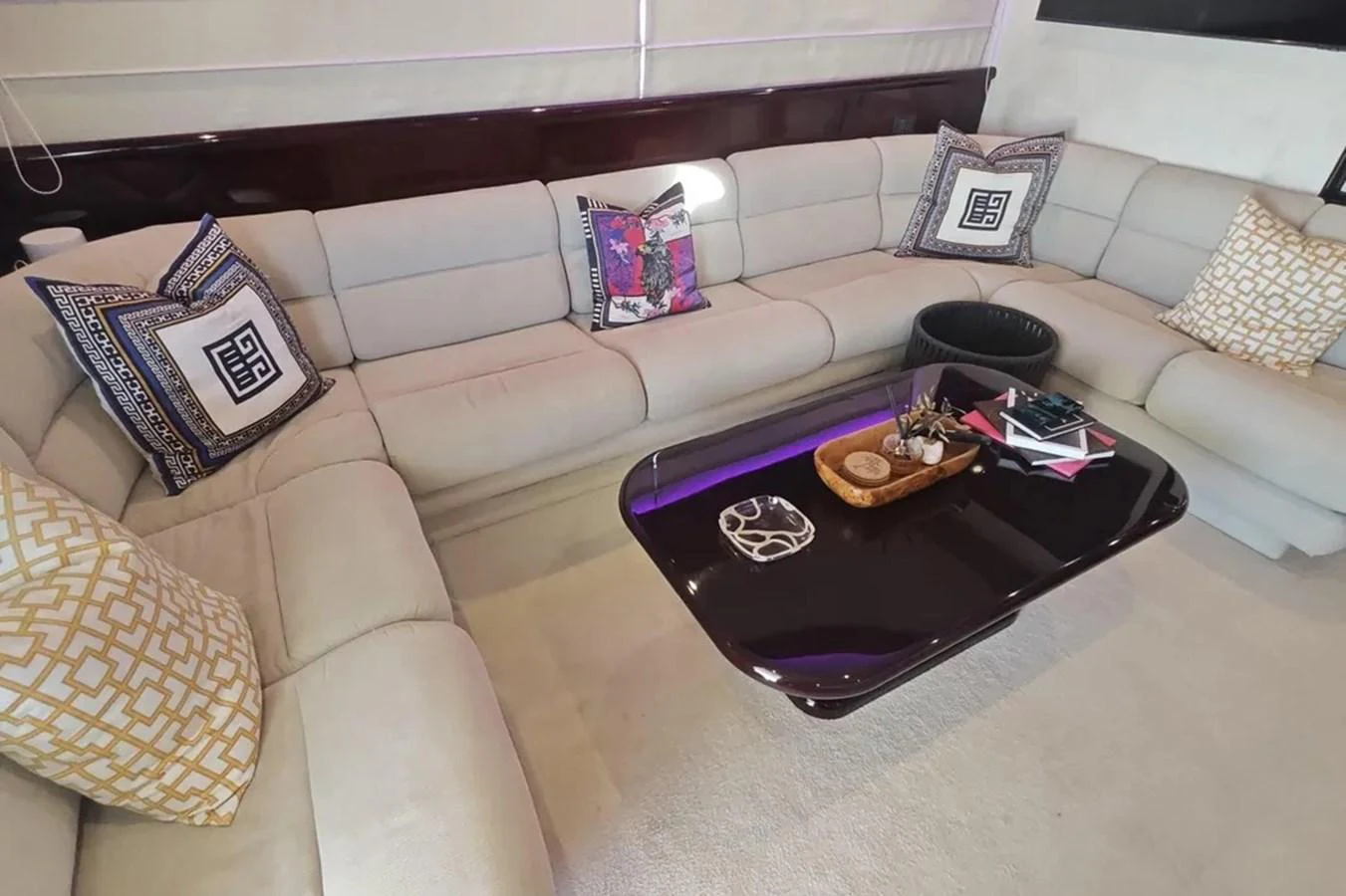a couch with a coffee table aboard HINXXLVI02 Yacht for Sale