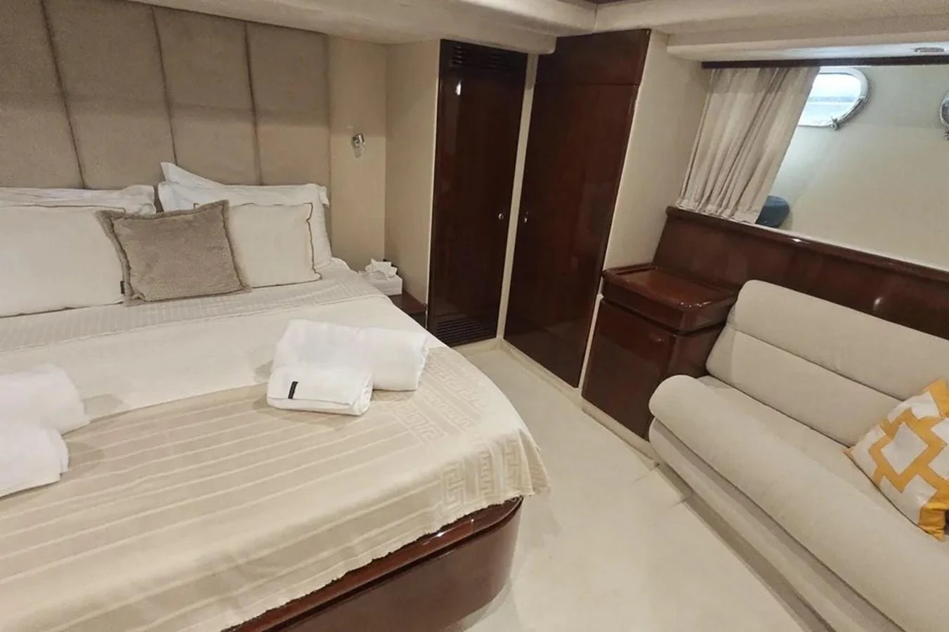 a room with beds and a chair aboard HINXXLVI02 Yacht for Sale