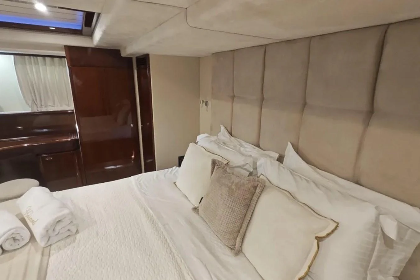 a bed with pillows aboard HINXXLVI02 Yacht for Sale