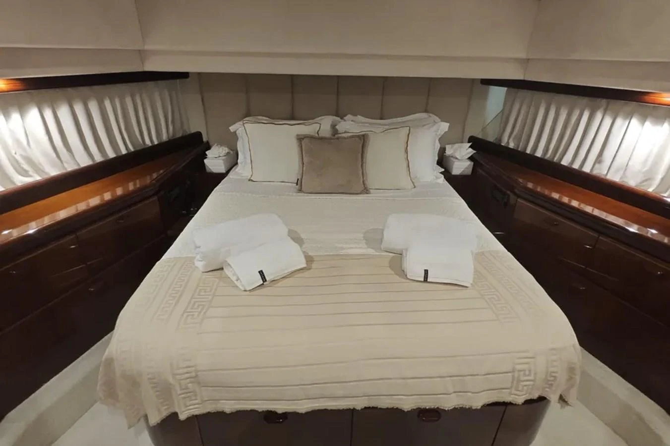 a bed with white sheets aboard HINXXLVI02 Yacht for Sale