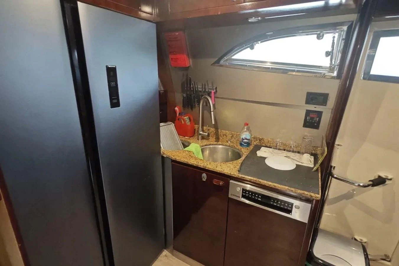 a kitchen with a sink and a refrigerator aboard HINXXLVI02 Yacht for Sale