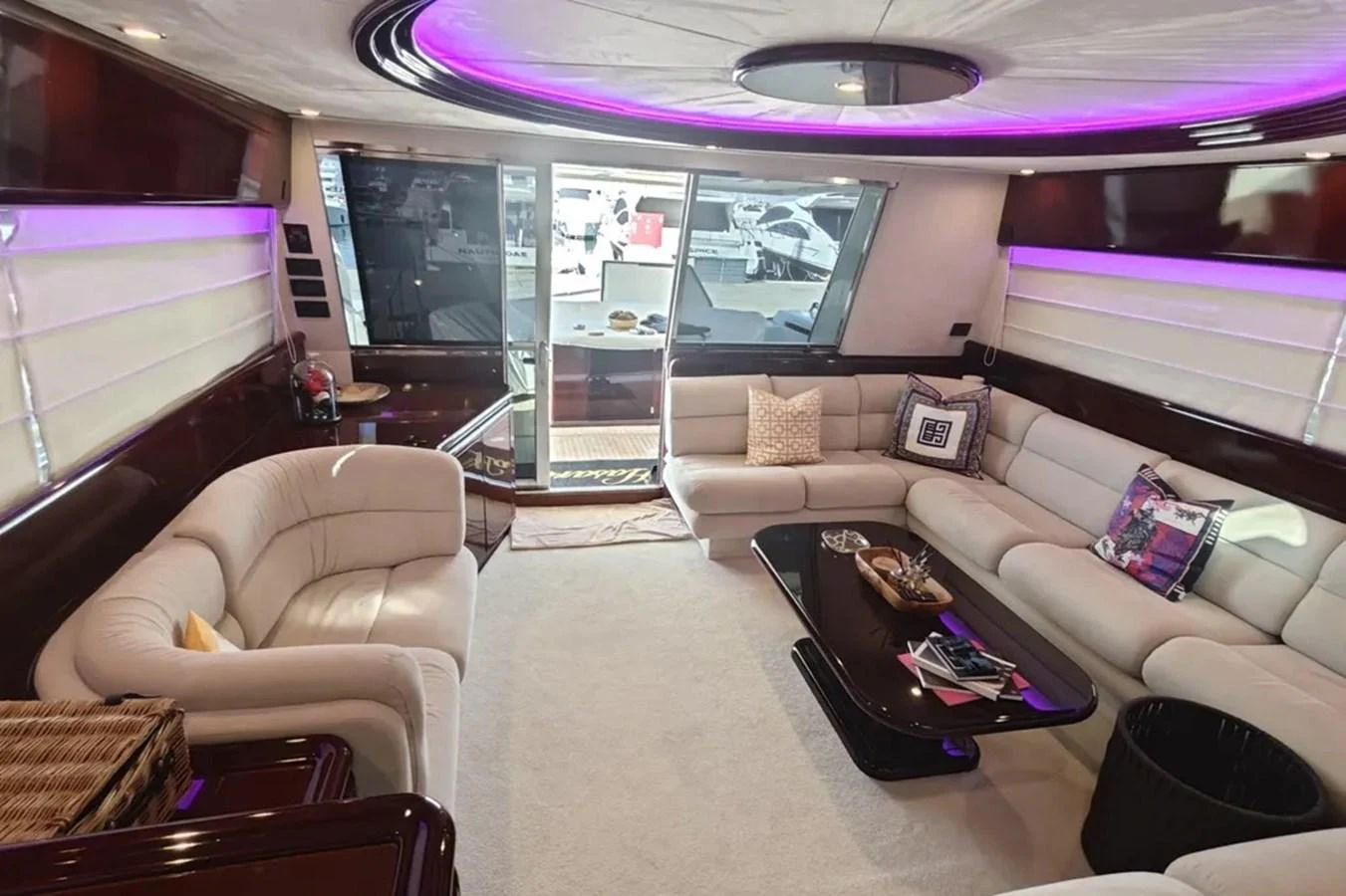 a living room with a large fish tank aboard HINXXLVI02 Yacht for Sale