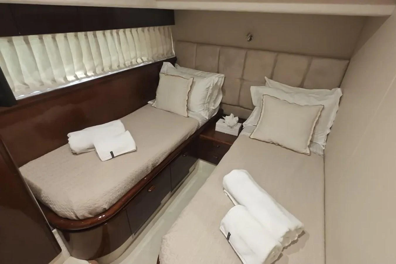 a hotel room with a bed and a white bed aboard HINXXLVI02 Yacht for Sale