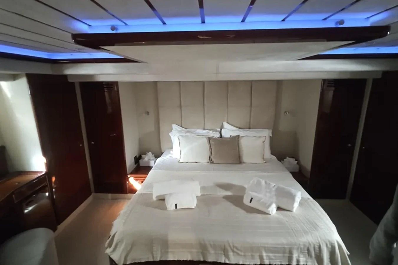 a bed with white sheets aboard HINXXLVI02 Yacht for Sale