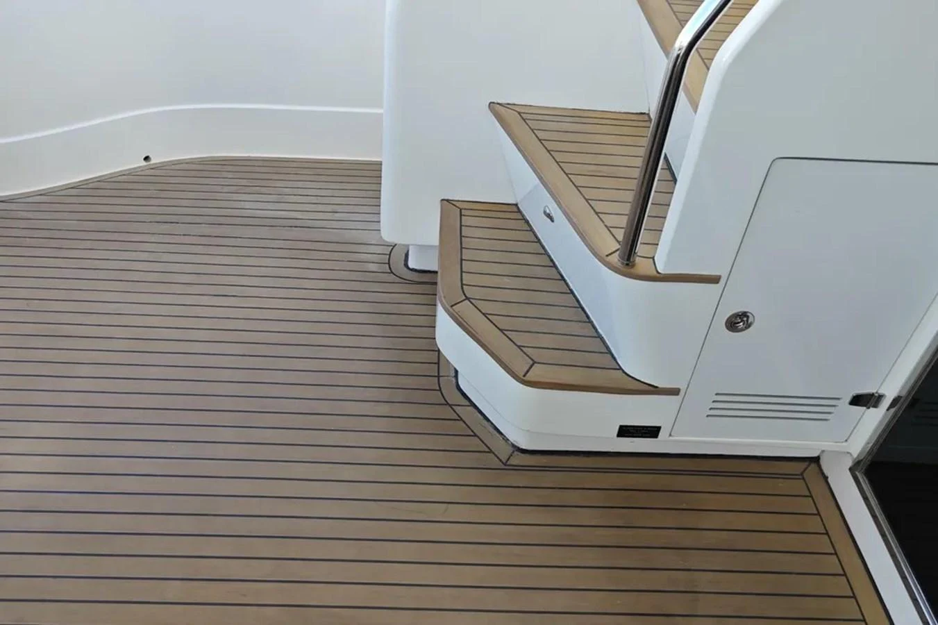a white and wood staircase aboard HINXXLVI02 Yacht for Sale