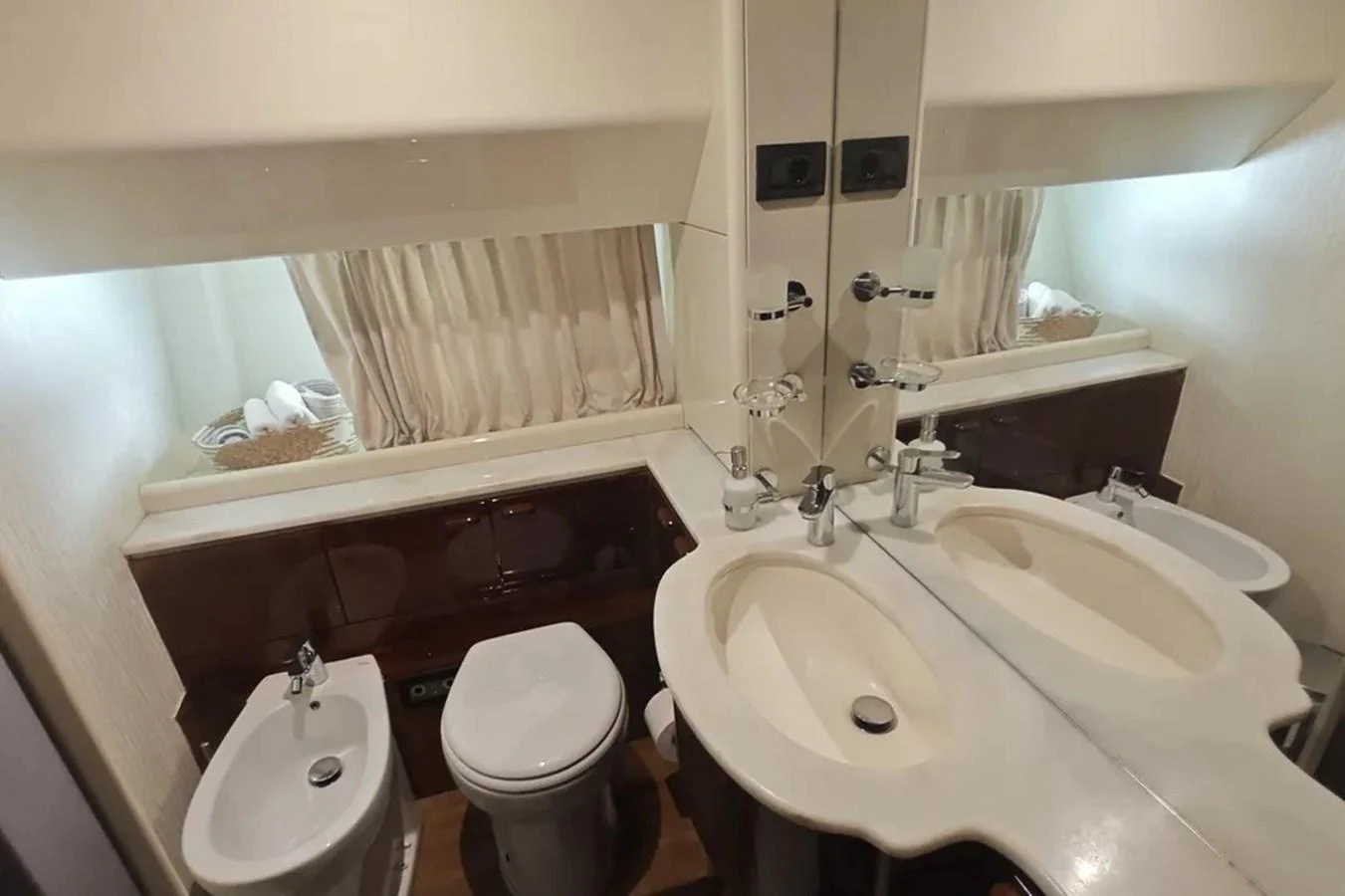 a bathroom with a sink and toilet aboard HINXXLVI02 Yacht for Sale