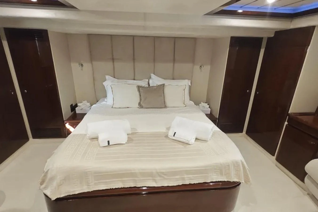 a bed with white sheets aboard HINXXLVI02 Yacht for Sale