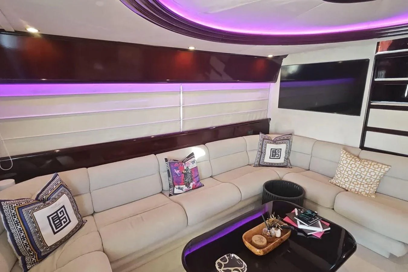 a living room with a couch and a table aboard HINXXLVI02 Yacht for Sale