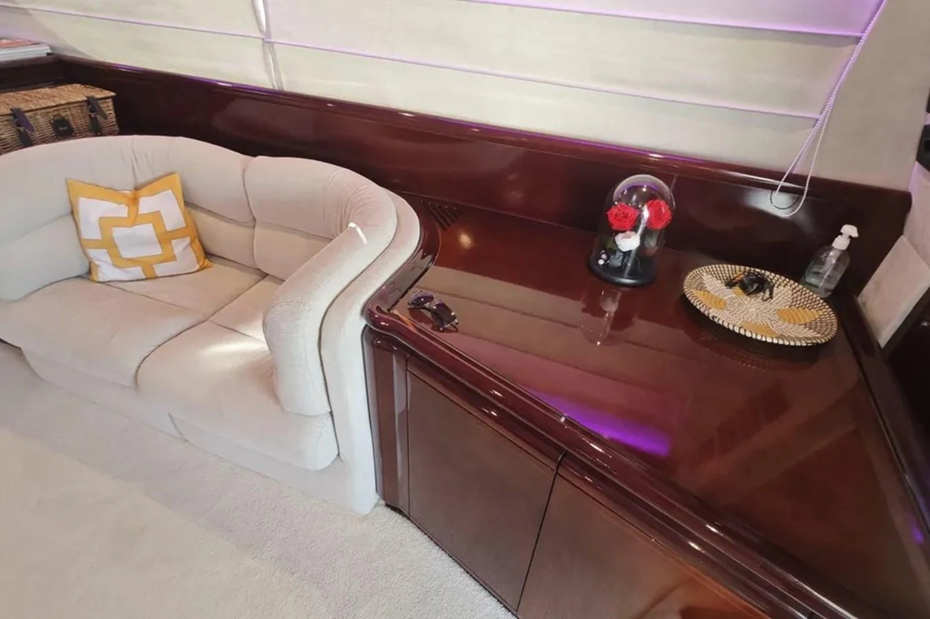 a living room with a couch and a coffee table aboard HINXXLVI02 Yacht for Sale