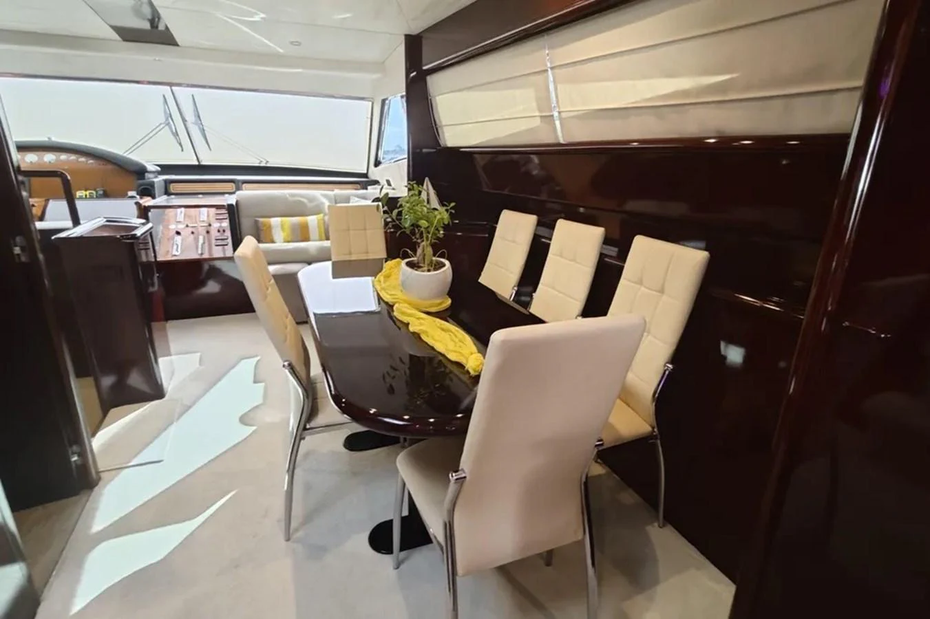 a room with chairs and tables aboard HINXXLVI02 Yacht for Sale