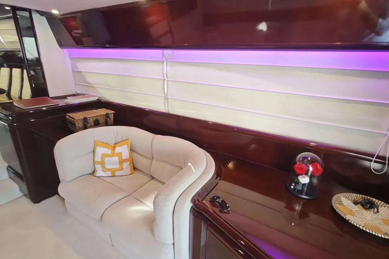 a living room with a couch and a piano aboard HINXXLVI02 Yacht for Sale