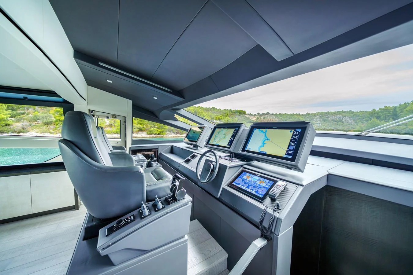 The helm station offers a sleek, modern design with advanced navigation systems and panoramic views. aboard MAVIS Yacht for Sale