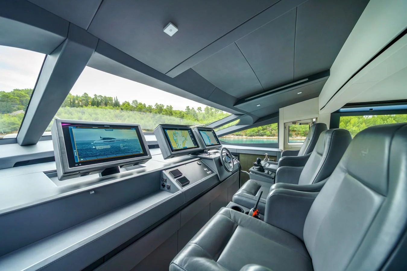 The helm station features state-of-the-art navigation equipment and luxurious seating. aboard MAVIS Yacht for Sale