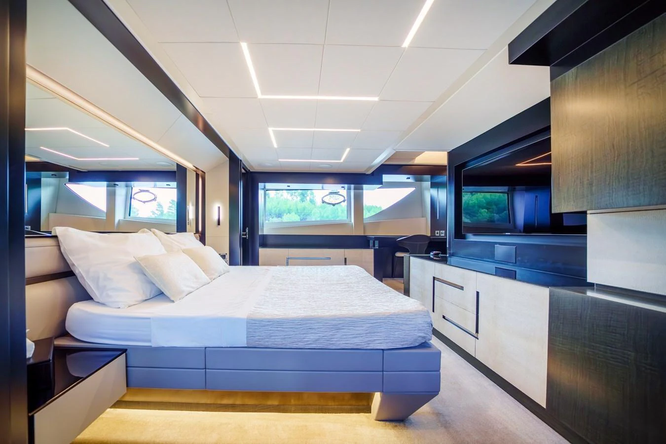 The master stateroom features a modern design with luxurious bedding and ample natural light. aboard MAVIS Yacht for Sale