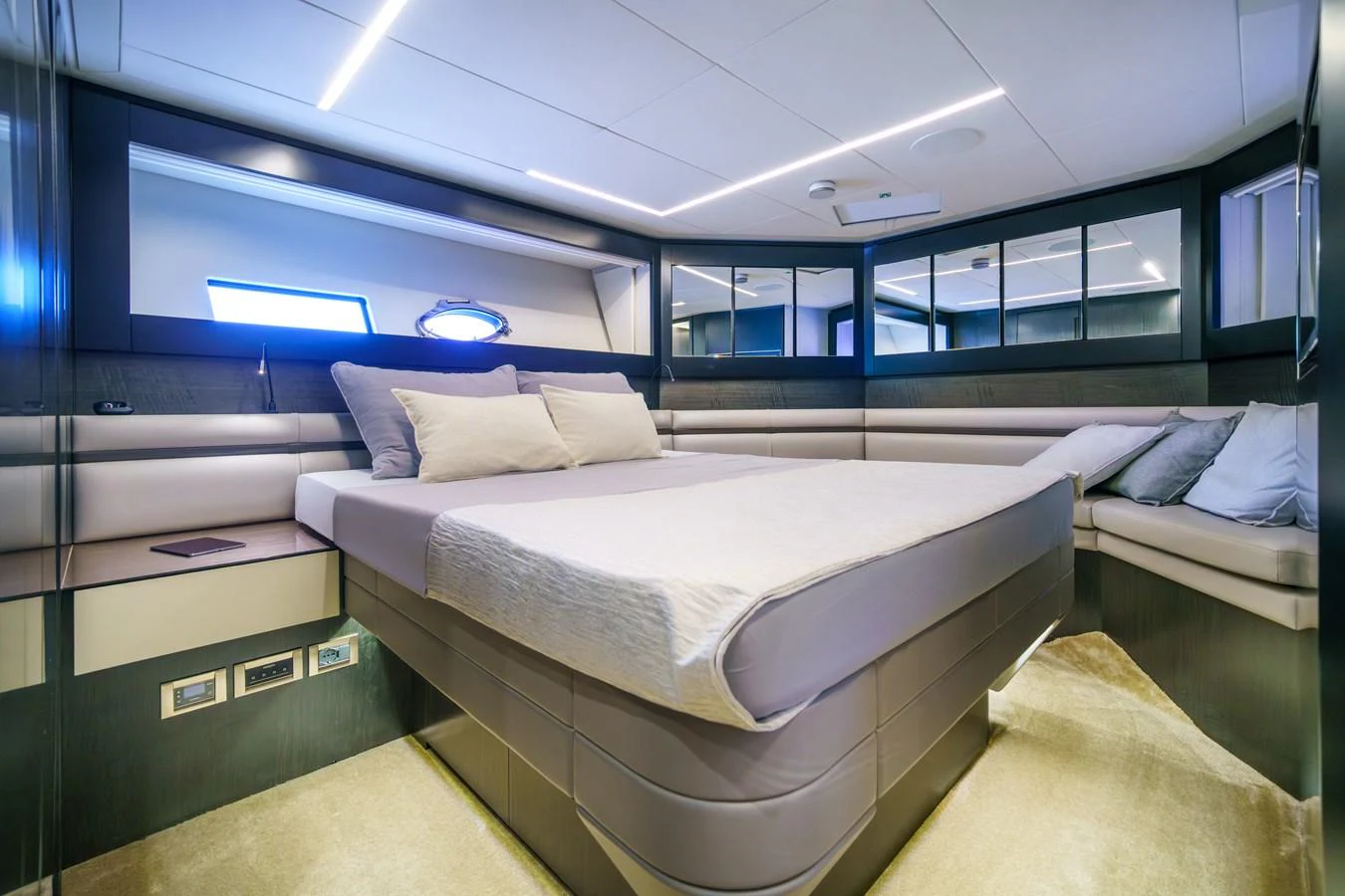 A luxurious stateroom featuring a large bed, modern lighting, and elegant decor. aboard MAVIS Yacht for Sale