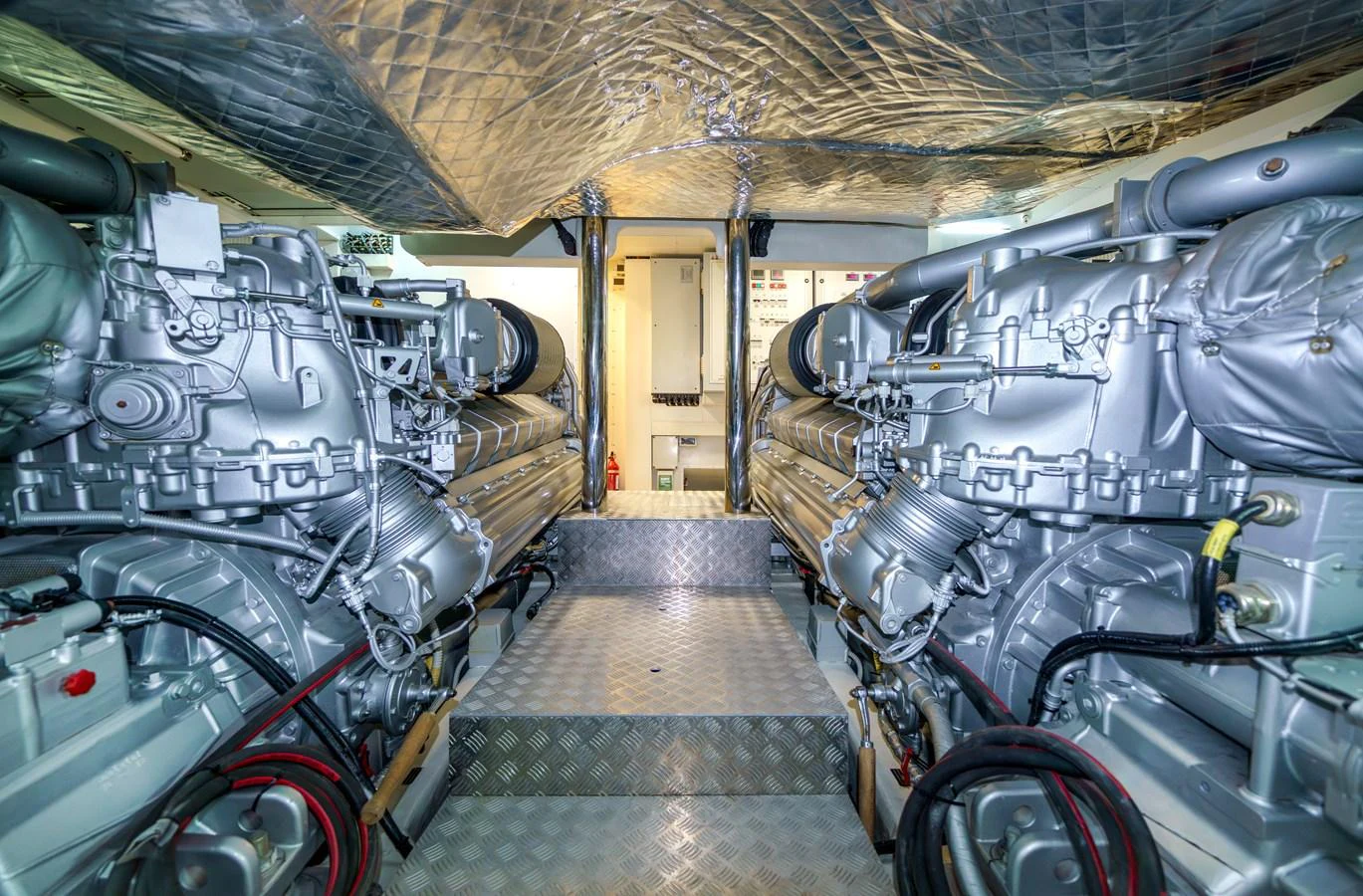 The image showcases the meticulously maintained engine room of the yacht, highlighting its powerful machinery. aboard MAVIS Yacht for Sale