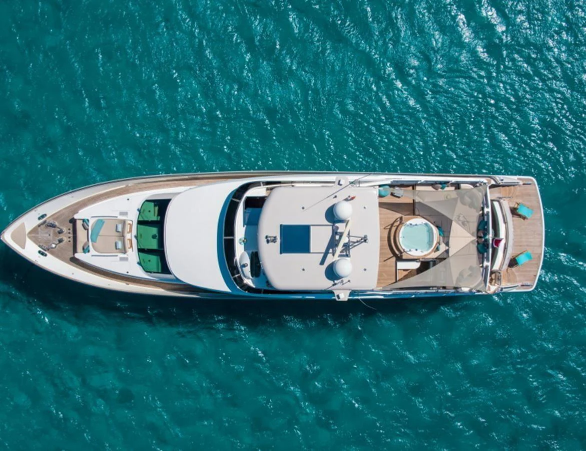 An aerial view of a luxurious yacht cruising on clear blue waters. aboard MR & MRS SMITH Yacht for Sale