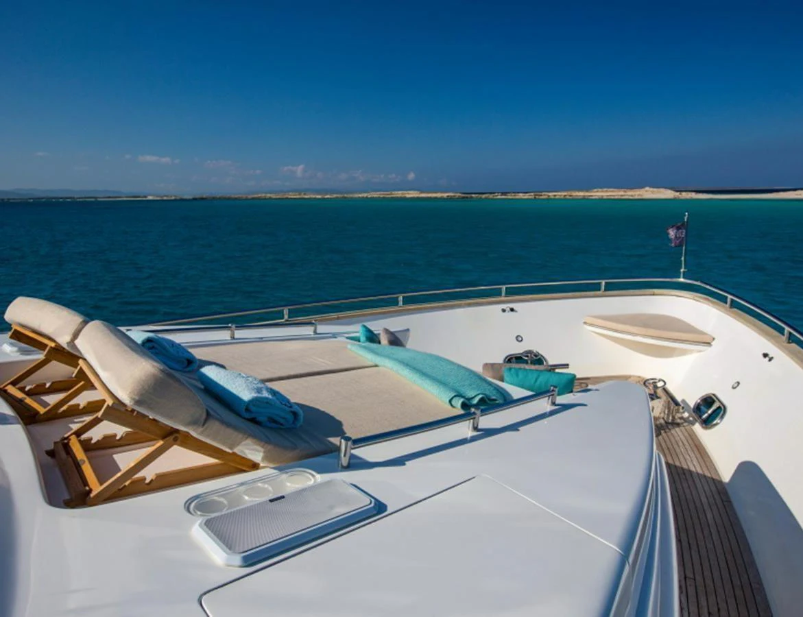 The foredeck offers a serene lounging area with sunbeds and a stunning view of the open sea. aboard MR & MRS SMITH Yacht for Sale