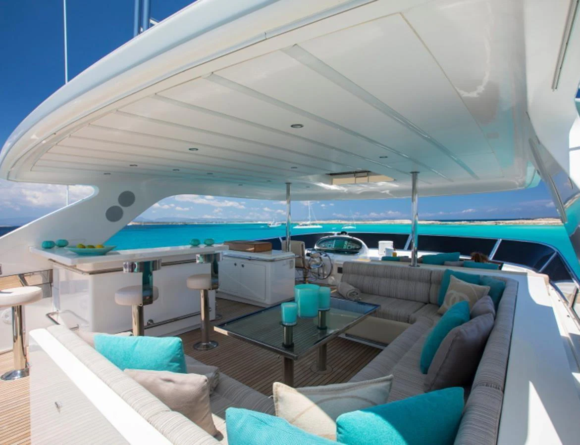 The flybridge offers a spacious and luxurious seating area with stunning ocean views. aboard MR & MRS SMITH Yacht for Sale