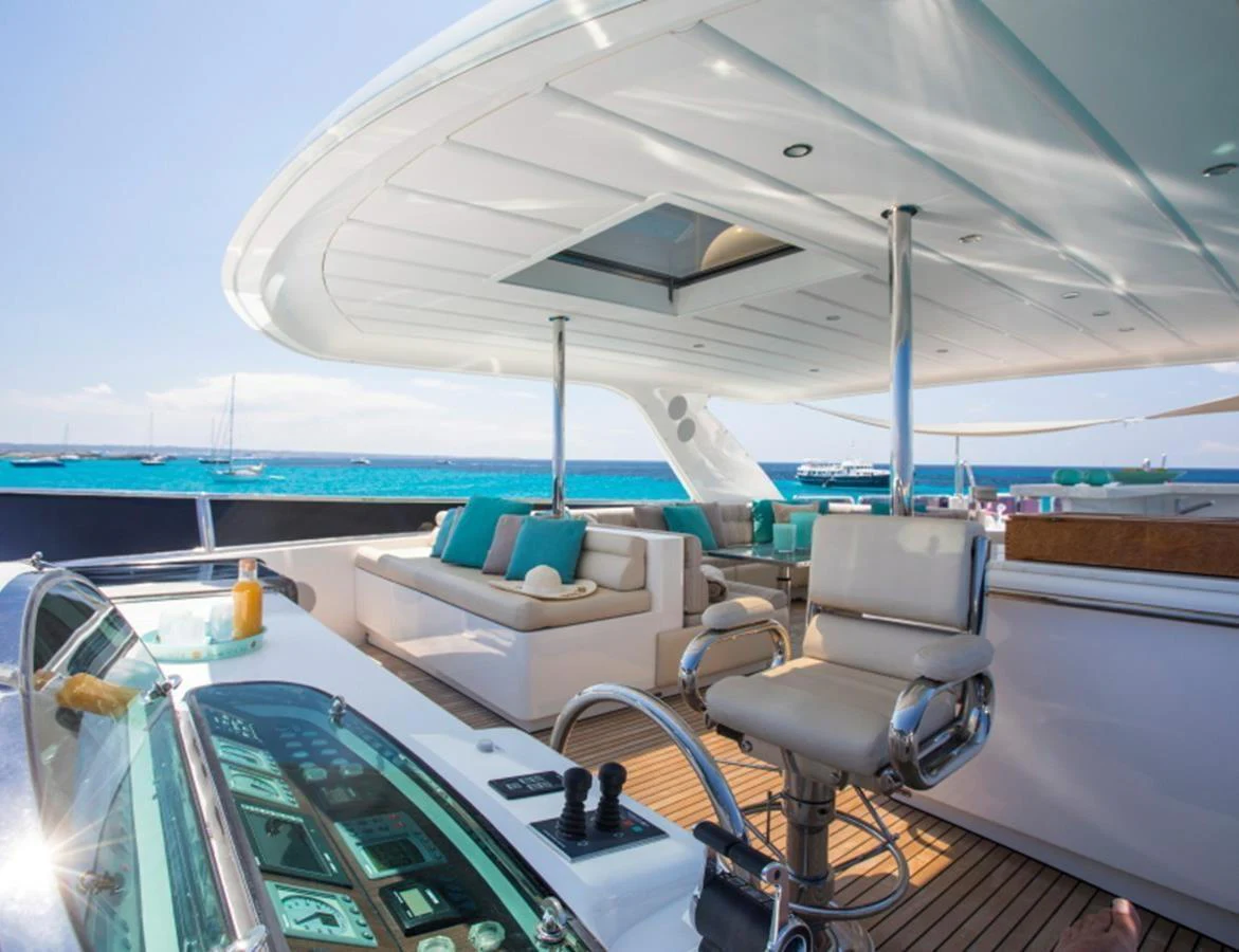 The flybridge offers a luxurious outdoor seating area with stunning ocean views. aboard MR & MRS SMITH Yacht for Sale