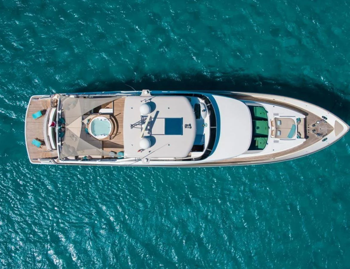 A stunning aerial view of a luxurious yacht cruising on clear blue waters. aboard MR & MRS SMITH Yacht for Sale