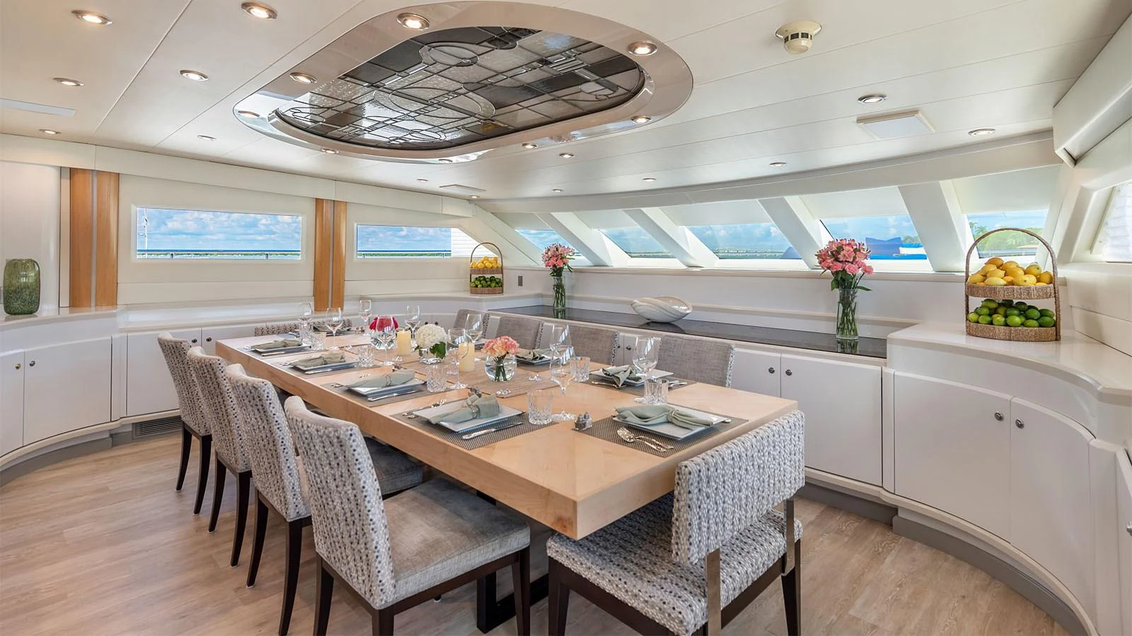 a large kitchen with a table and chairs aboard SURINA Yacht for Sale