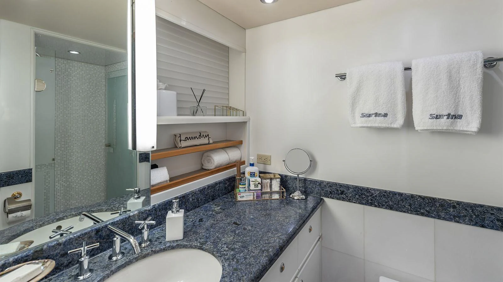 a bathroom with a large mirror aboard SURINA Yacht for Sale