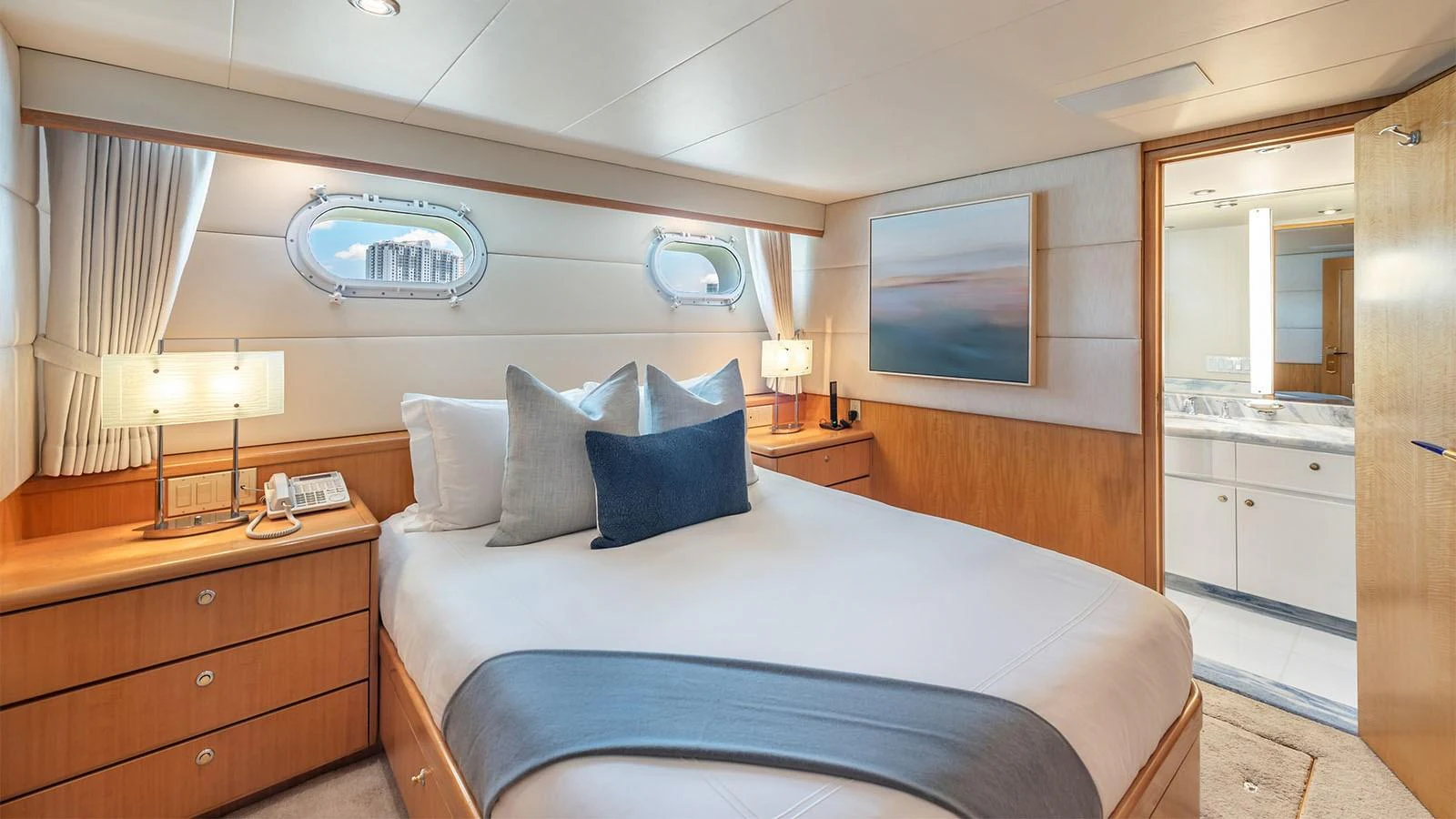 a bedroom with a bed and a television aboard SURINA Yacht for Sale