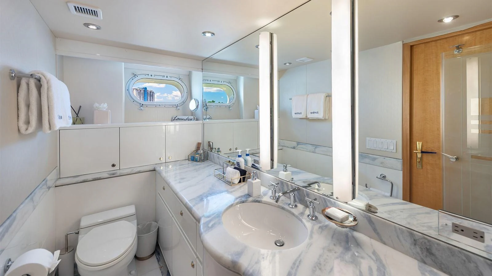 a bathroom with a large mirror aboard SURINA Yacht for Sale