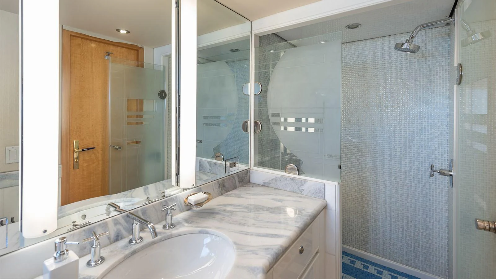 a bathroom with a large mirror aboard SURINA Yacht for Sale