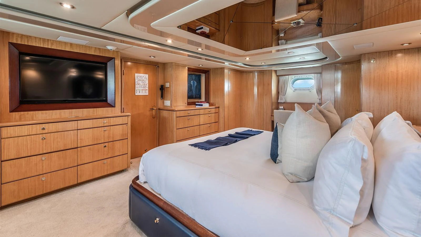 a bed with white sheets and pillows aboard SURINA Yacht for Sale