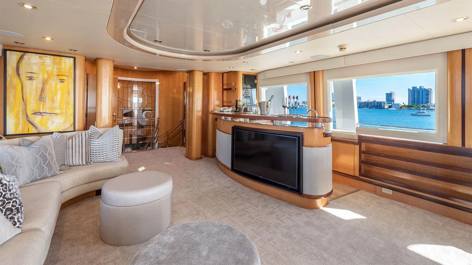 a living room with a large tv aboard SURINA Yacht for Sale