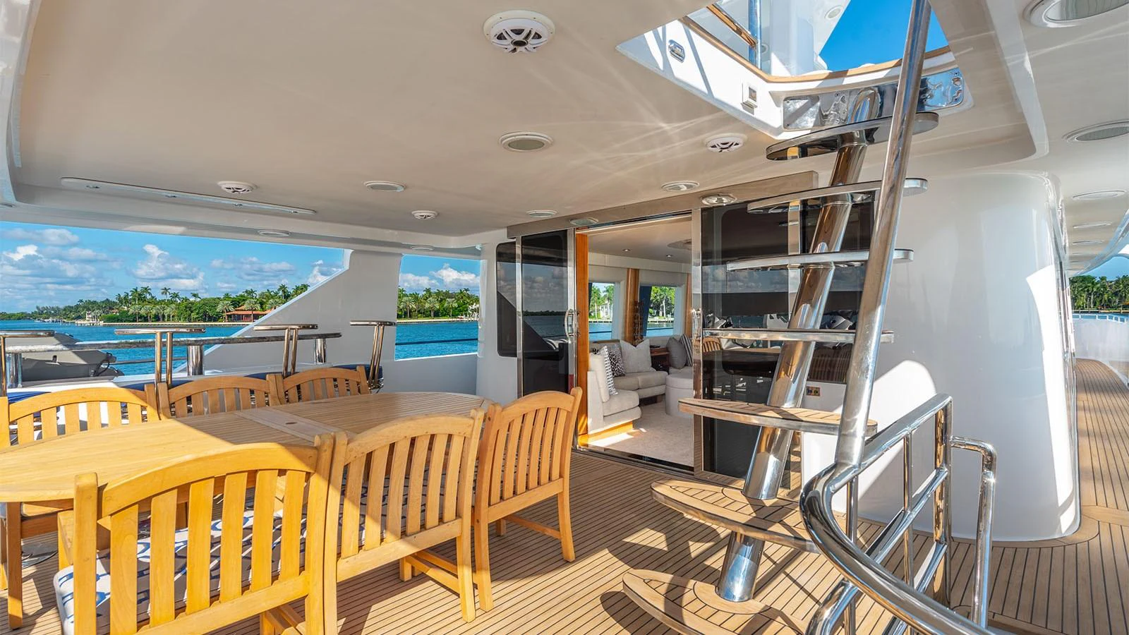 a room with tables and chairs aboard SURINA Yacht for Sale