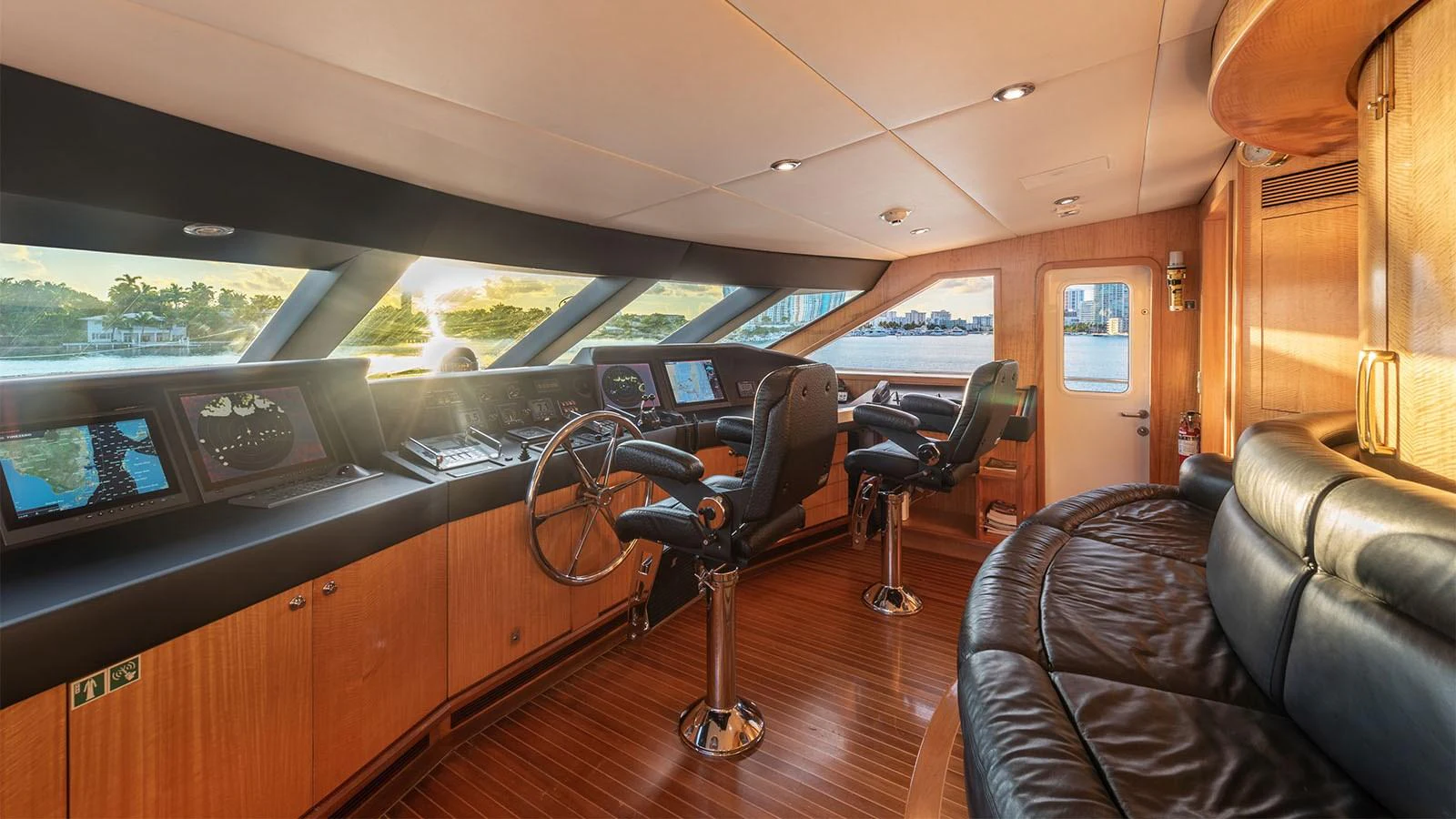 inside of a vehicle with a seat and steering wheel aboard SURINA Yacht for Sale