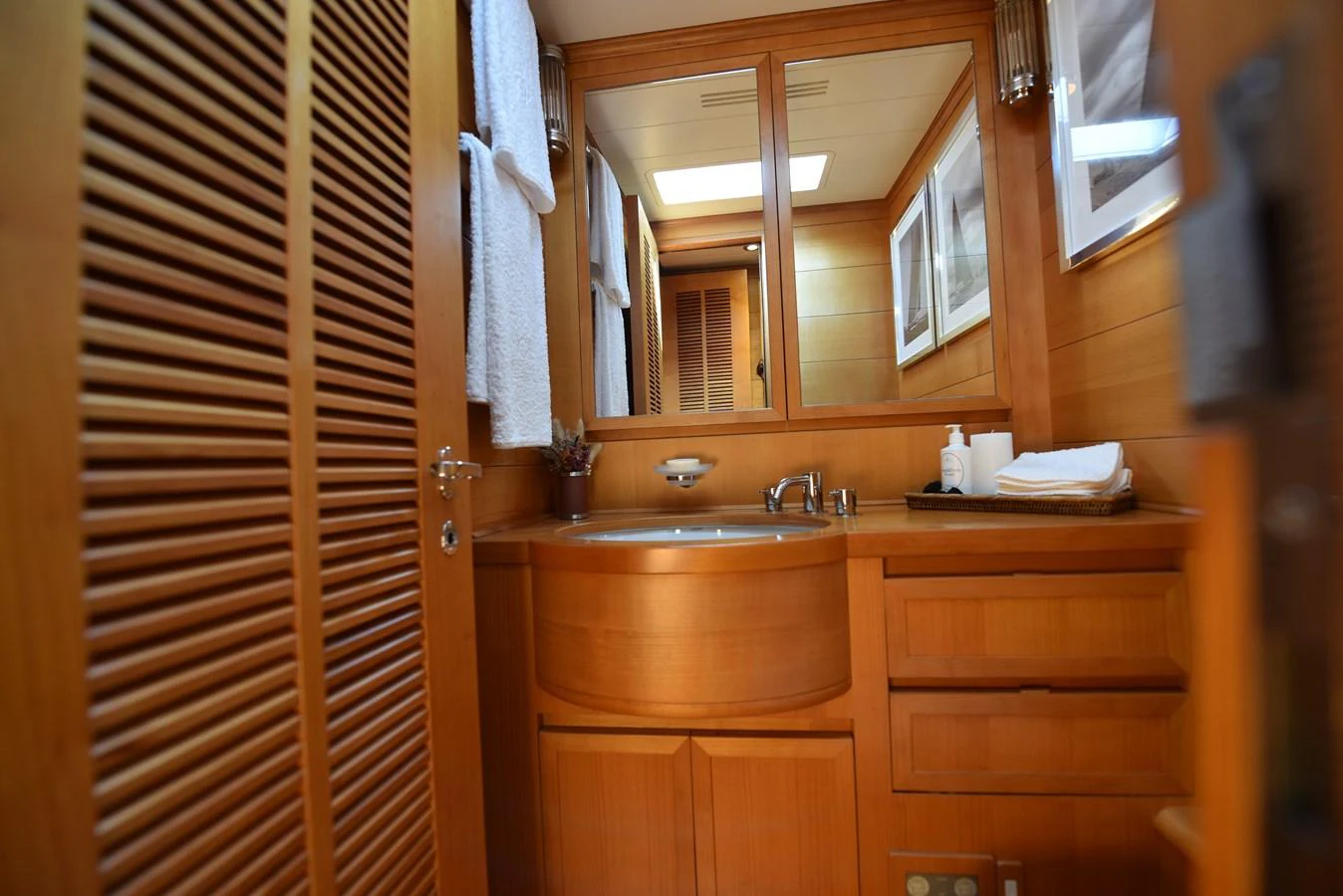 a bathroom with a sink and cabinets aboard GREEN EYES Yacht for Sale