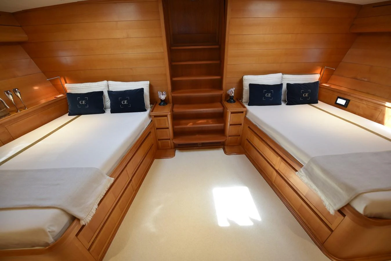 a room with a couple beds aboard GREEN EYES Yacht for Sale