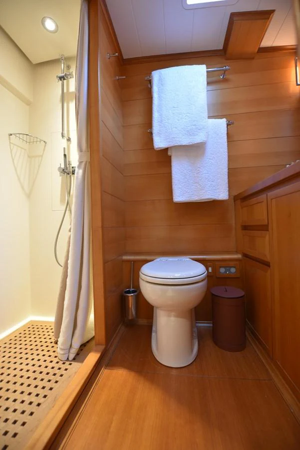 a bathroom with a toilet and a sink aboard GREEN EYES Yacht for Sale