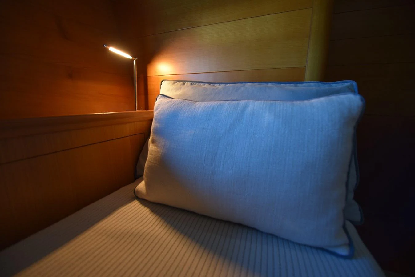 a pillow on a bed aboard GREEN EYES Yacht for Sale