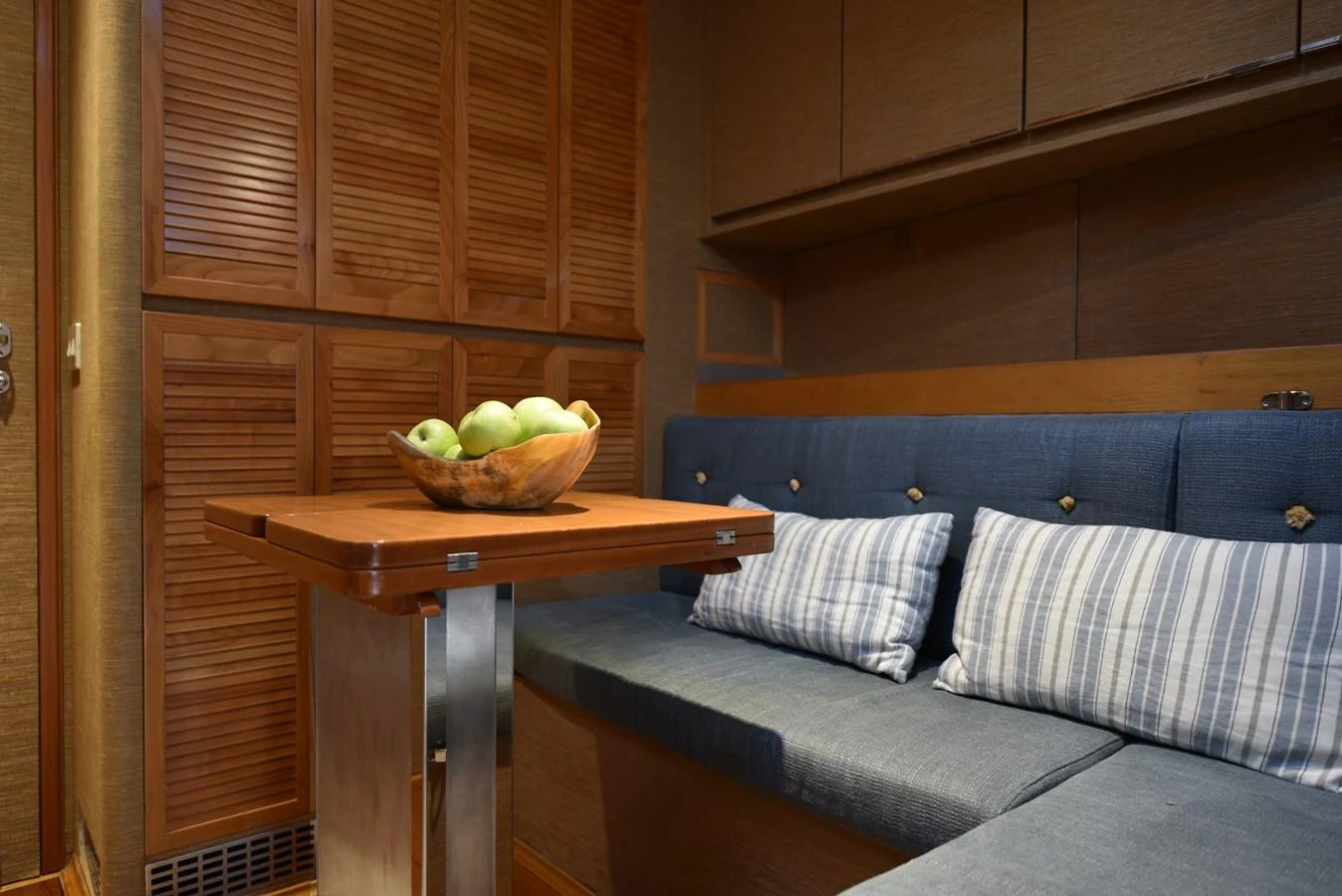 a couch and a table in a room aboard GREEN EYES Yacht for Sale